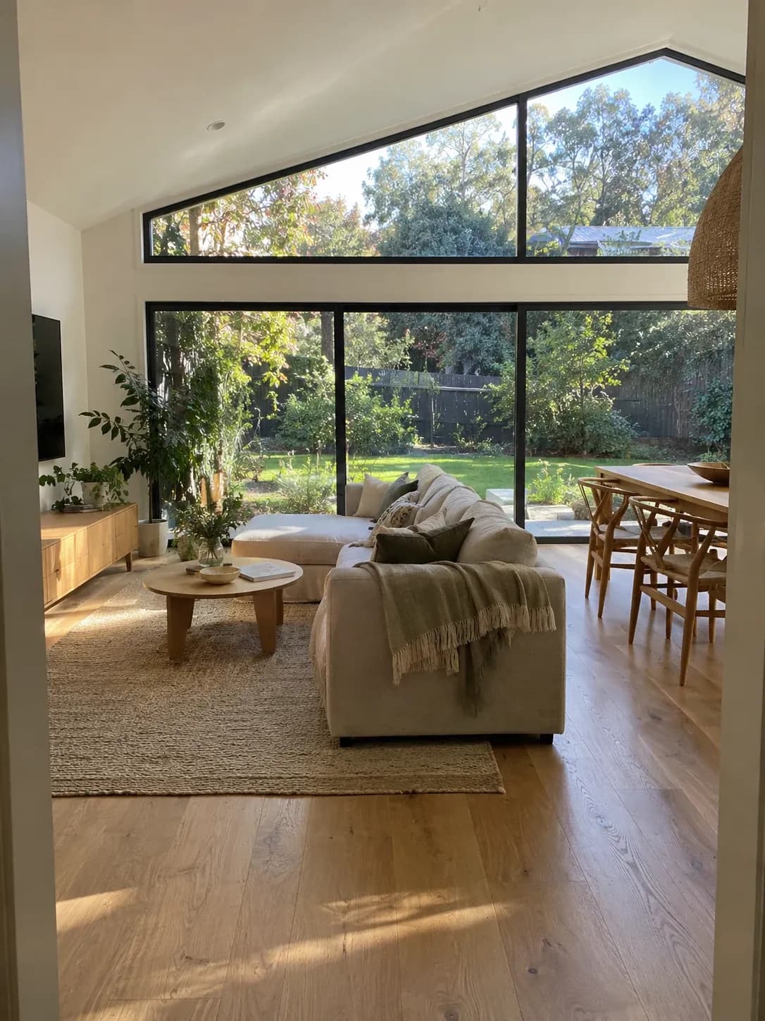 Open-plan family room inside a new rear extension with a raked ceiling