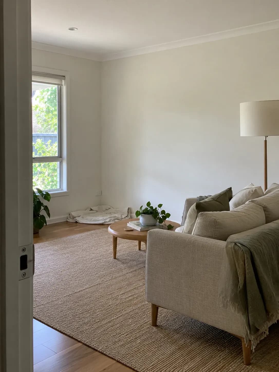 Freshly painted living room walls in a warm white with crisp ceiling lines